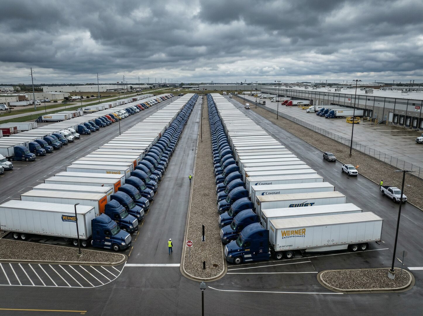 Semi trucks parked at a freight yard — trucking document preparation service